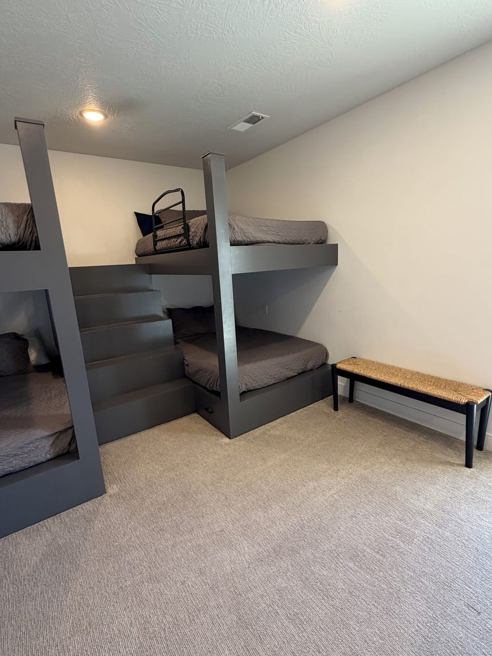 2 large full/full bunks, couch area, large TV, and large patio seating access.