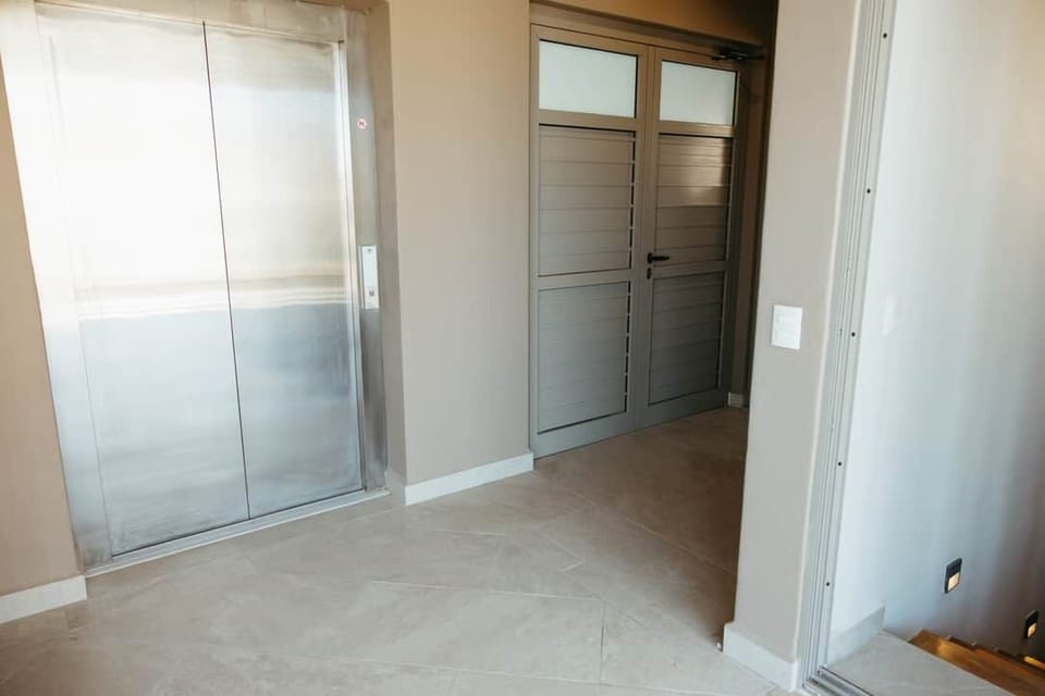 Personal Elevator to Skylounge and Steps down to Main Living Area