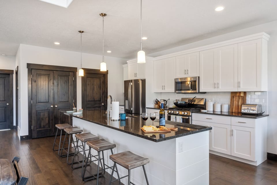 Bright, open kitchen with a large island and bar seating