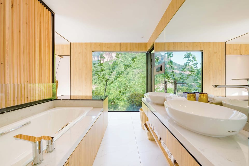 Panoramic Double Room, Mountain View | Bathroom | Hair dryer, slippers, towels, soap