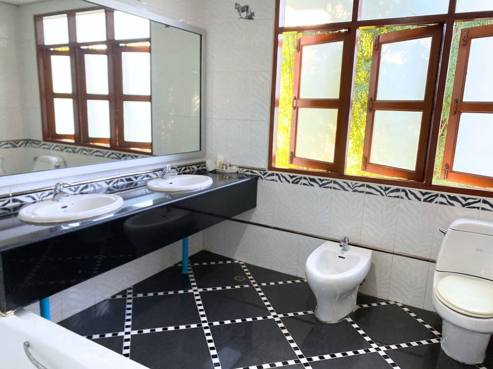 Luxury Double or Twin Room, Garden View | Bathroom | Hair dryer, slippers, towels, soap