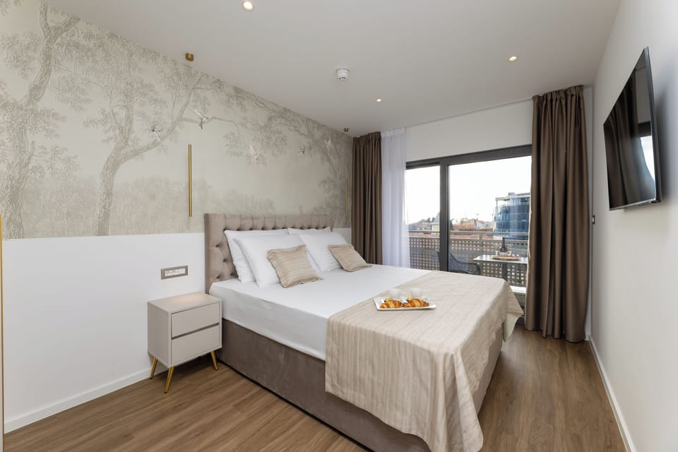 Standard Double or Twin Room with Balcony | In-room safe, desk, laptop workspace, blackout drapes