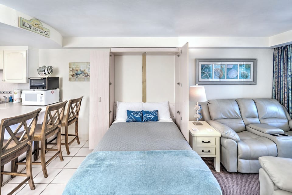 Murphy bed tucks away to open the living space
