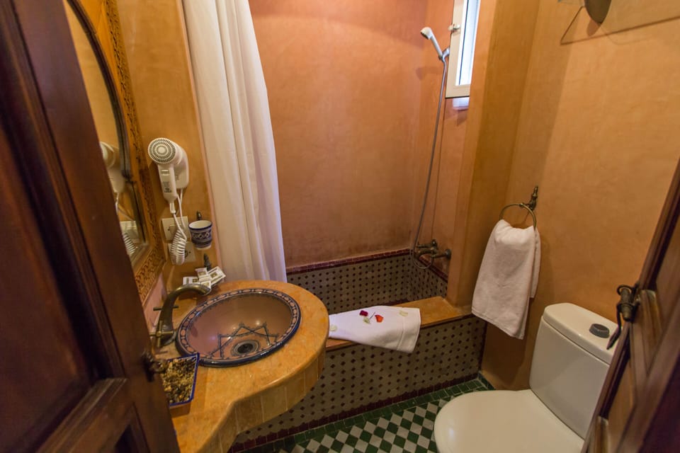 Shower, rainfall showerhead, hair dryer, towels