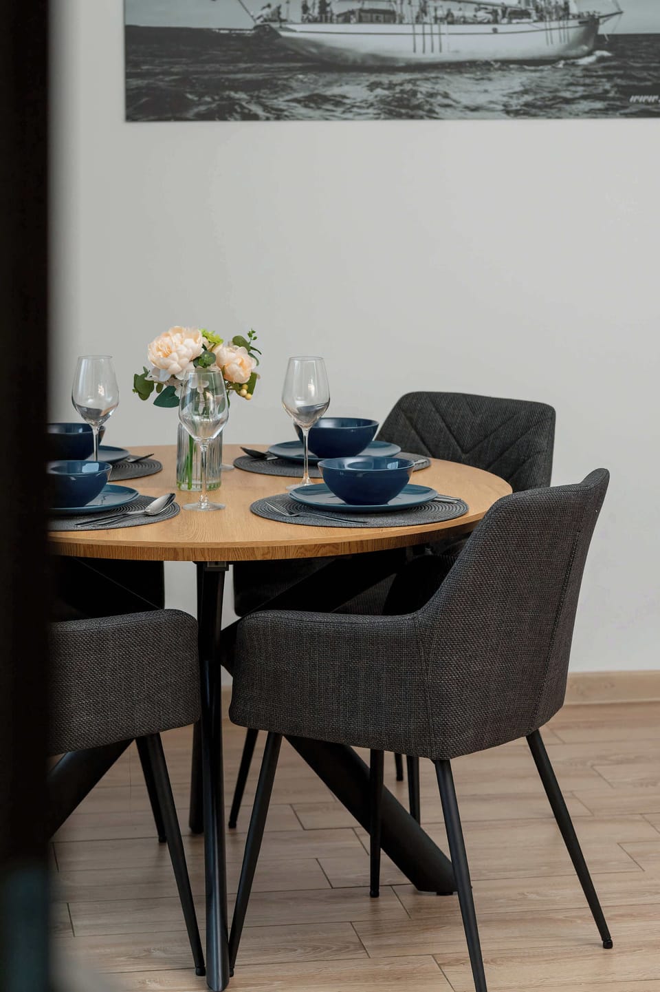 The thoughtfully arranged dining table encourages enjoying meals in a harmonious, home-like atmosphere.