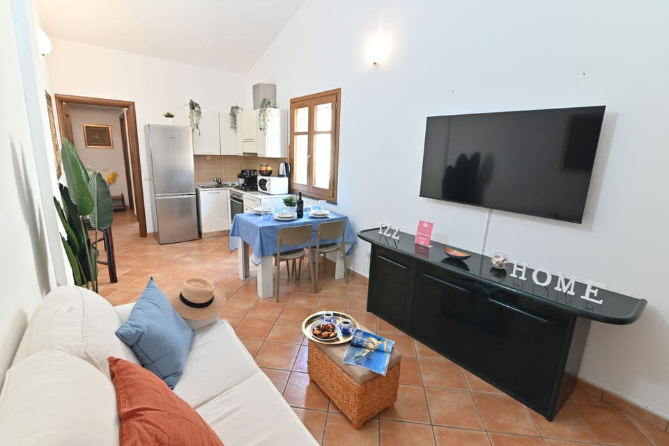 Apartment, City View | Living area | Flat-screen TV