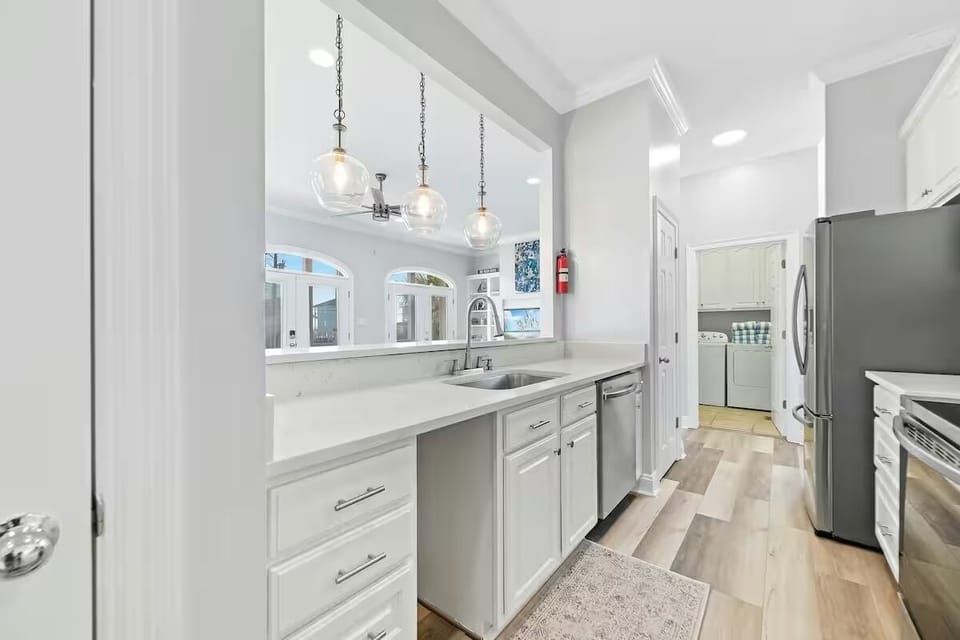 Kitchen with bar eating area on other side.  