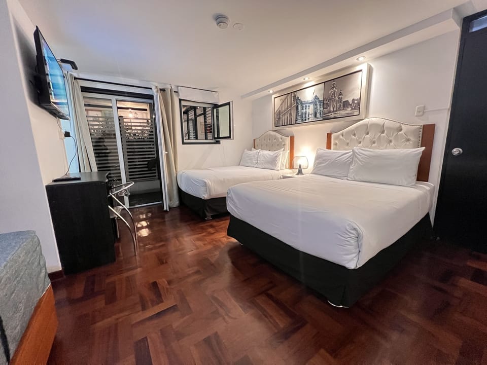 Family Room, Private Bathroom | Down comforters, minibar, in-room safe, desk