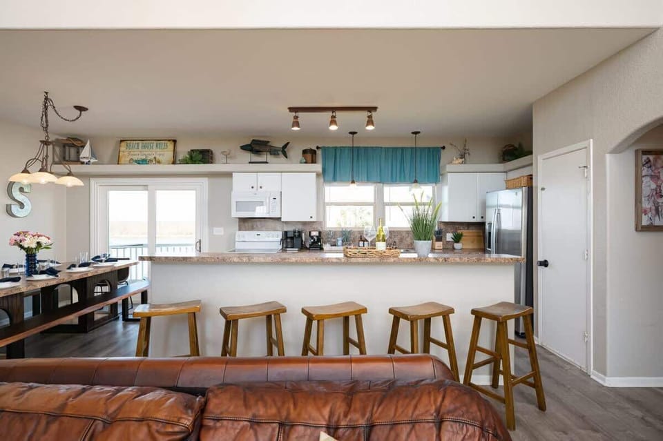 Kitchen: Bright and inviting, perfect for culinary adventures with stunning bay views.