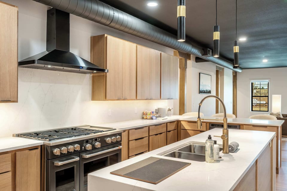 Premium appliances and generous counter space make cooking feel effortless.