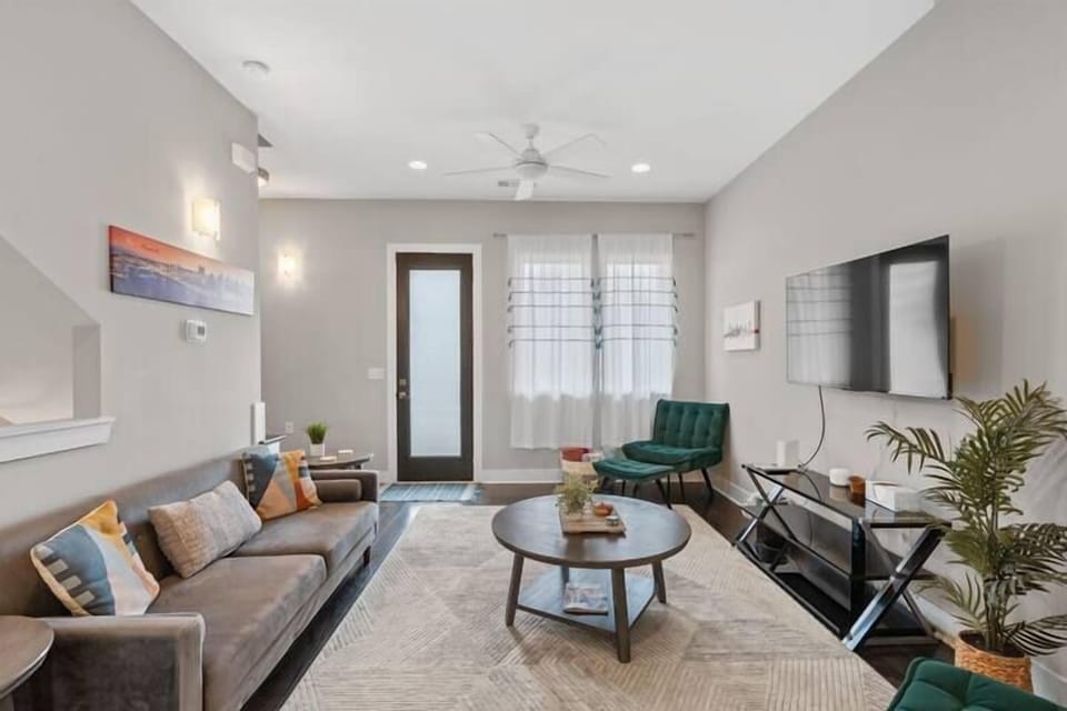 Living Area: A bright, modern living room with sleek décor and plenty of natural light.