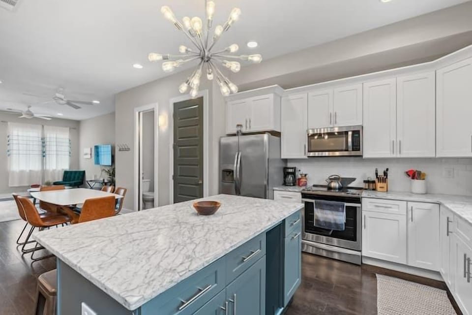 Kitchen: A modern kitchen with sleek finishes and updated appliances.