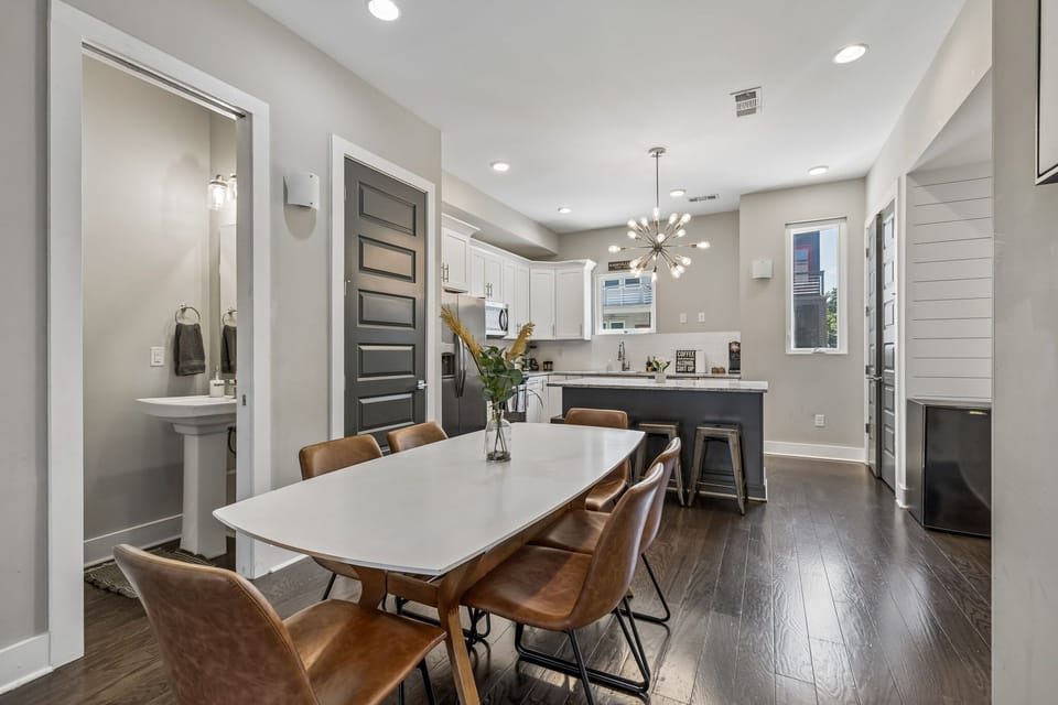 Dining Area: Gather around the dining table and enjoy meals together in a warm and inviting space designed for conversation, connection, and memorable moments.