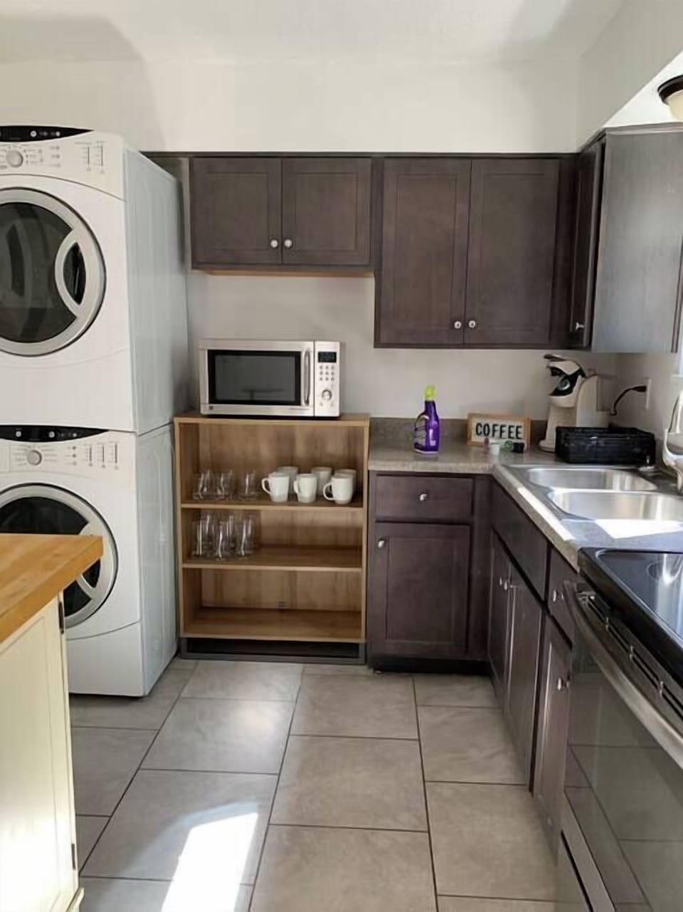 Kitchen: You'll also find cabinets filled with kitchen utensils ready for your meal preparations and dining needs.