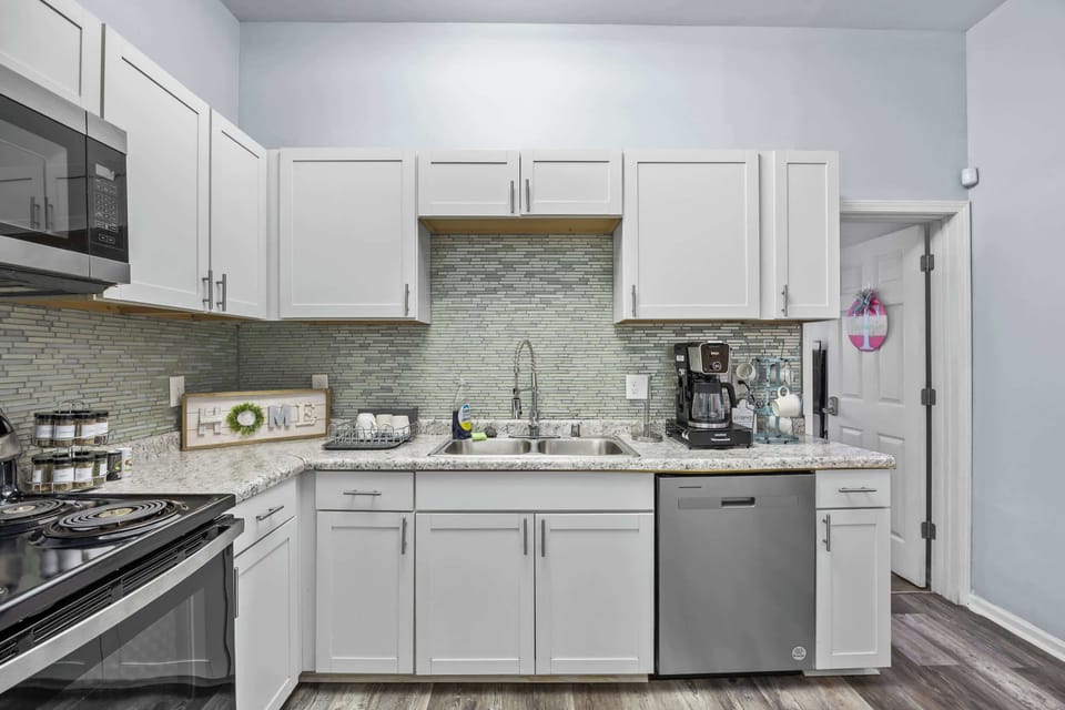 Kitchen: Full-size appliances & ample counter space for long-term comfort. Cook all your meals easily! Functionality is key for extended stays.