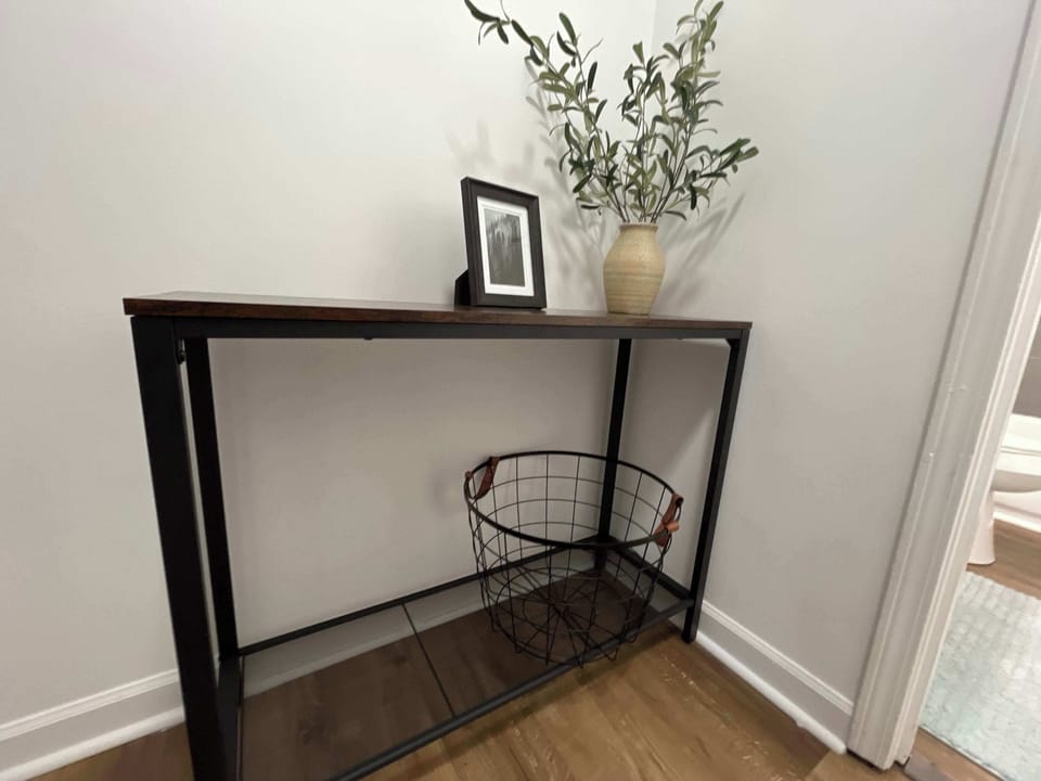 Before entering the bathroom, you'll see a console table stocked with complimentary toiletries we've got ready for you.