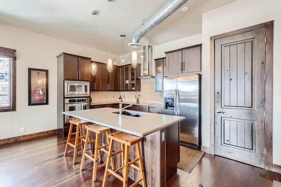 Kitchen: In our kitchen, you'll find new appliances like an oven, electric range, refrigerator, and microwave. These make cooking easy for you and your loved ones.