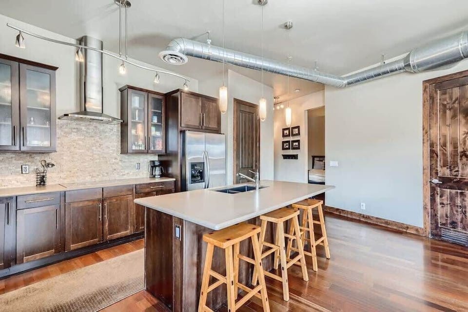 Kitchen: Additionally, we've added four high chairs at the countertop, providing extra seating when the dining area is full.