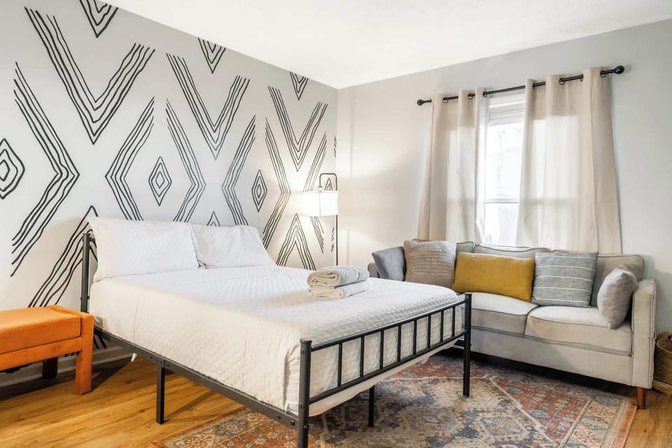 Bedroom 2: Tranquil bedroom space featuring soothing color tones and plenty of light, designed to help you relax and recharge.