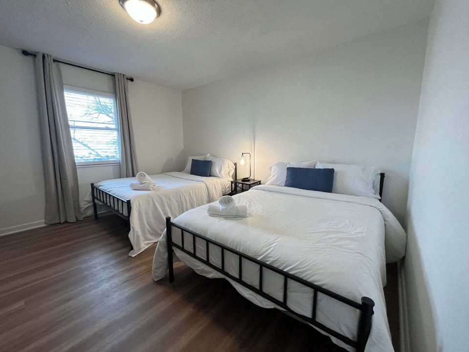 Bedroom 2: Our second bedroom is great for families or friends who want to stay together but have their own space. It has two comfy double-sized beds, perfect for up to 4 guests, all dressed with high-quality beddings for a comfortable sleep.