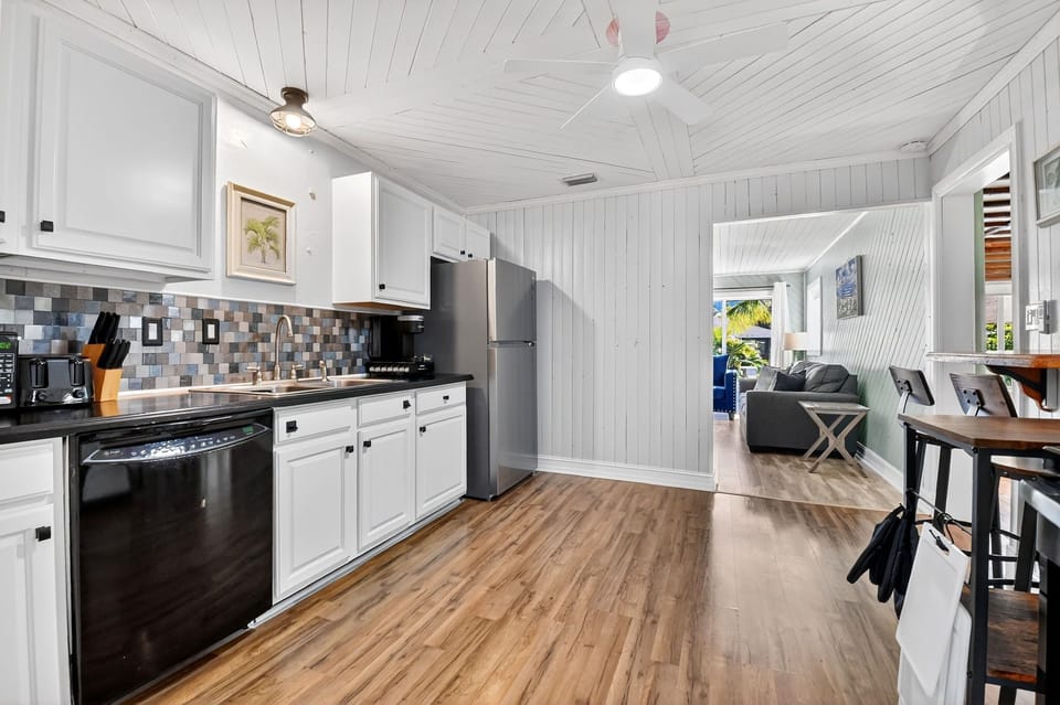 Fully-stocked kitchen with new fridge, electric stove, dishwasher, Kurig coffee.