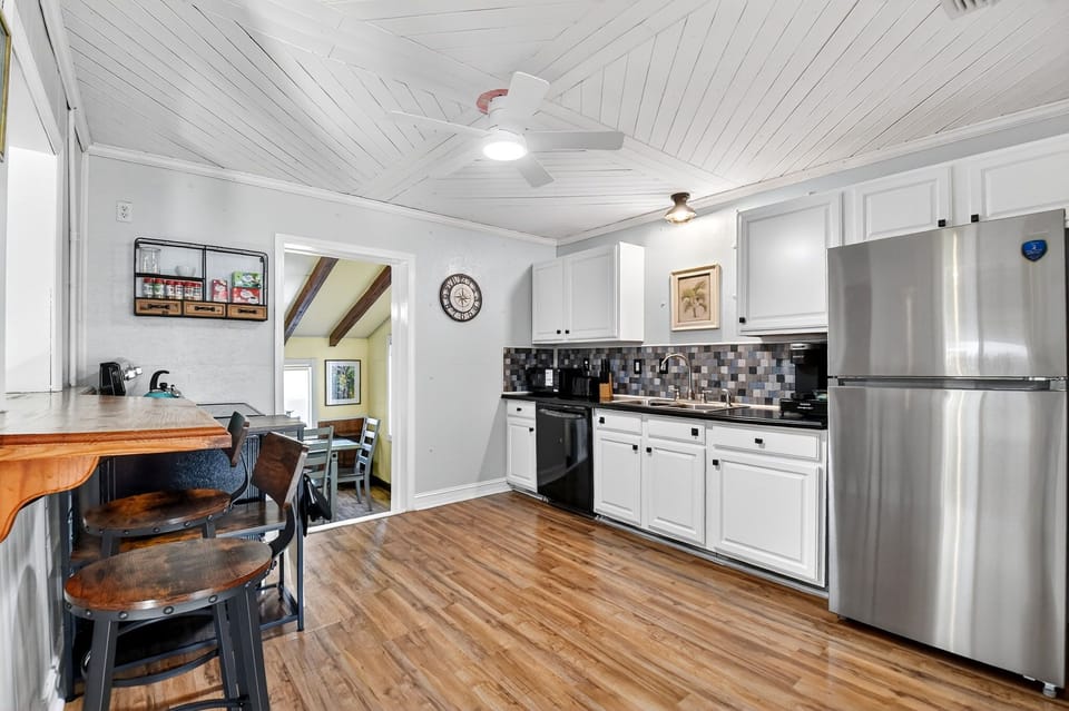 Fully-stocked kitchen with new fridge, electric stove, dishwasher, Kurig coffee.