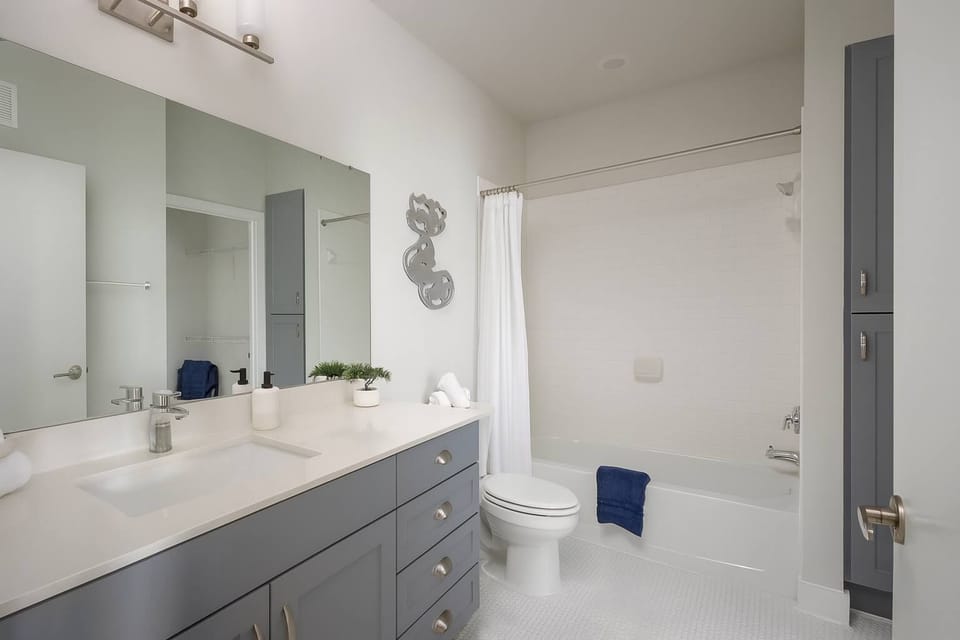 Clean, Minimalist Bathroom with Ample Storage