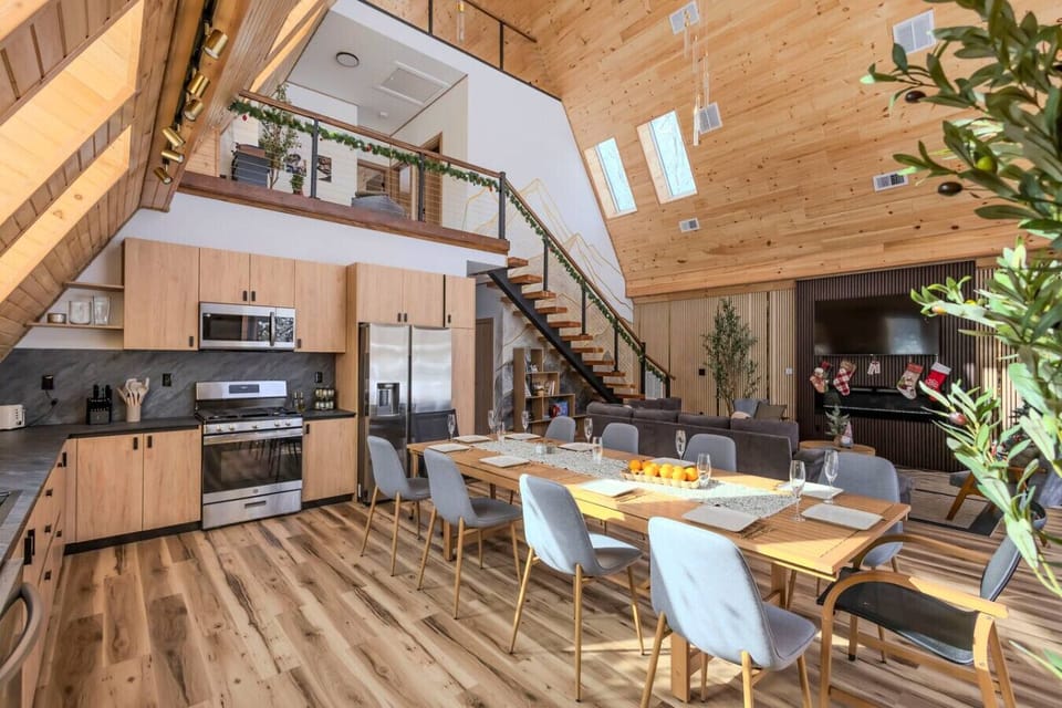 Spacious open-plan living room with a fully equipped kitchen and dining table.