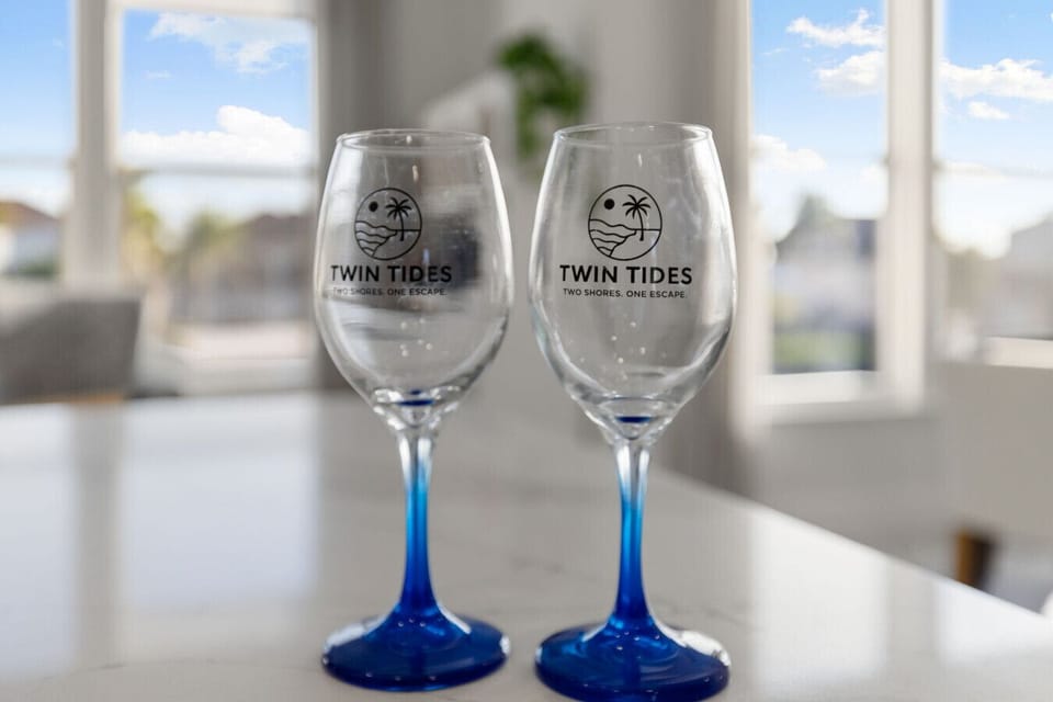 Personalized Twin Tides wine glasses to welcome you to the coast