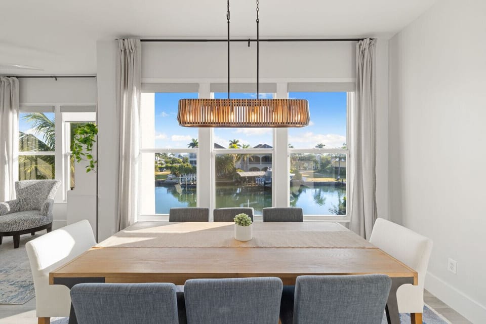 Spacious dining room overlooking the sparkling bay waters