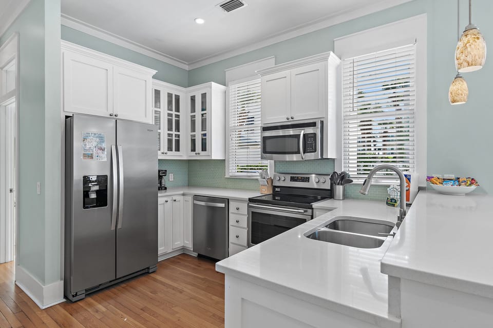Fully Stocked Kitchen - Cook in style in the remodeled kitchen with plenty of supplies and appliances, all with Pool and backyard views!