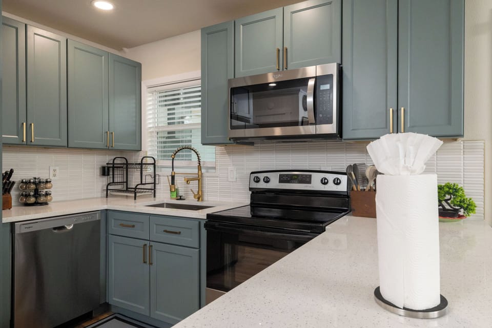 Modern kitchen with stainless appliances & a spacious island—perfect for cooking