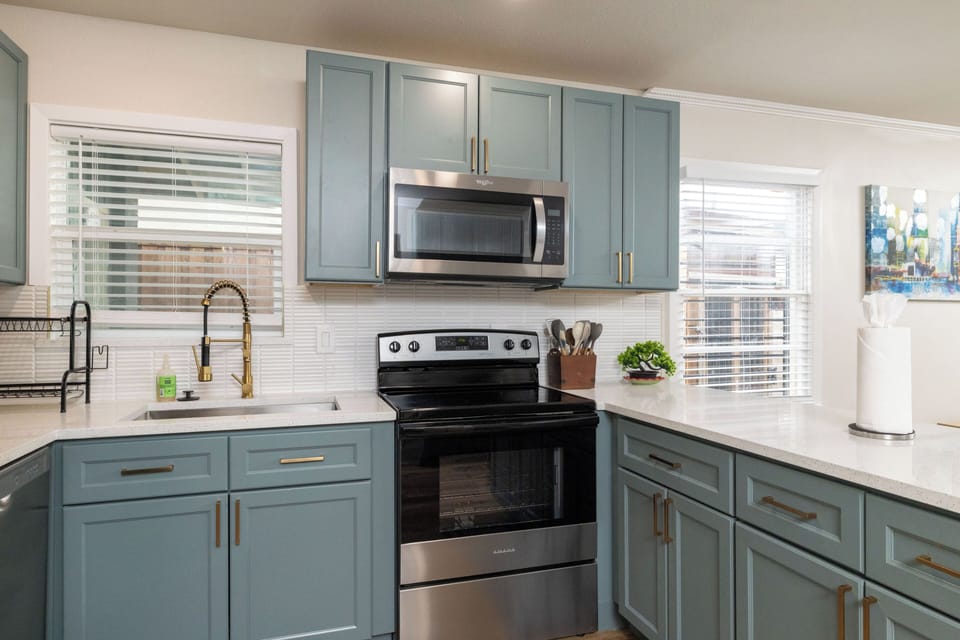 Modern kitchen with stainless appliances & a spacious island—perfect for cooking
