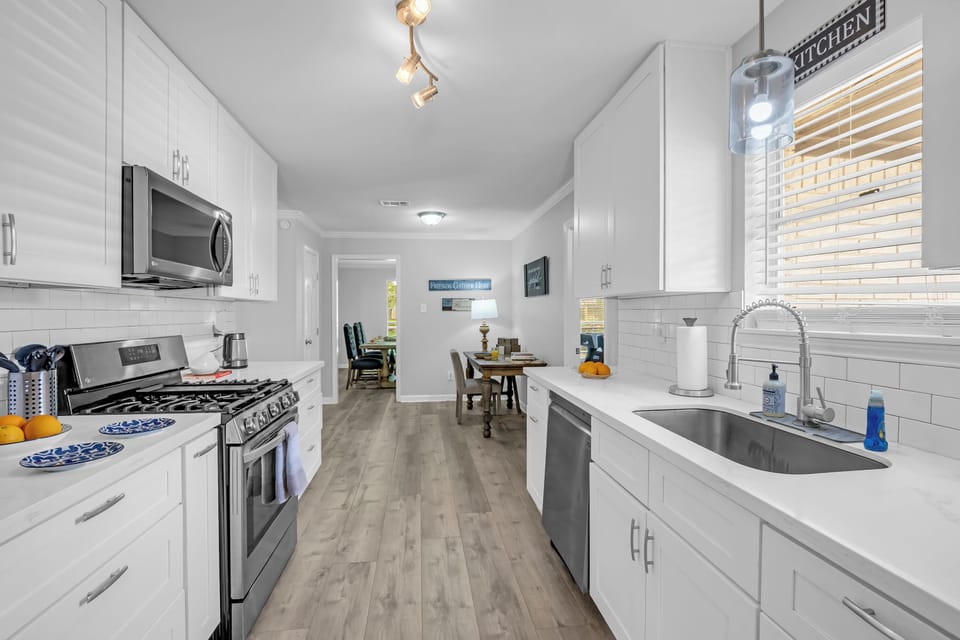 Bright modern kitchen with sleek cabinets, cozy charm, and elegant lighting vibe