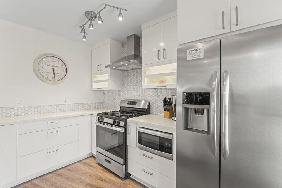 Modern kitchen w/ stainless appliances & ample counter space for easy prep