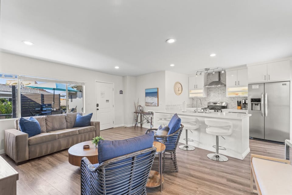 Spacious open-concept living & kitchen area ideal for gathering & unwinding