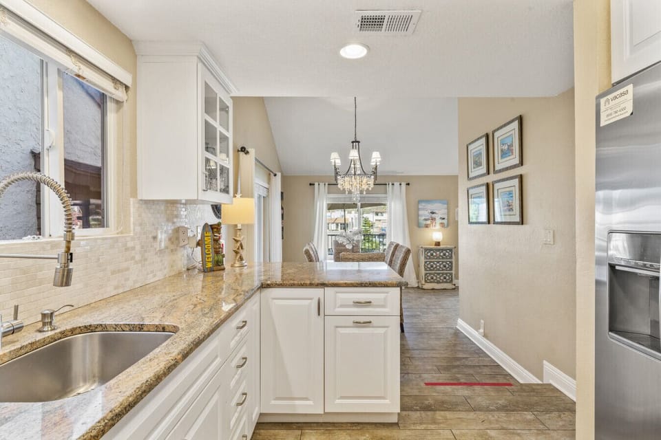 Dining area with chandelier and patio view