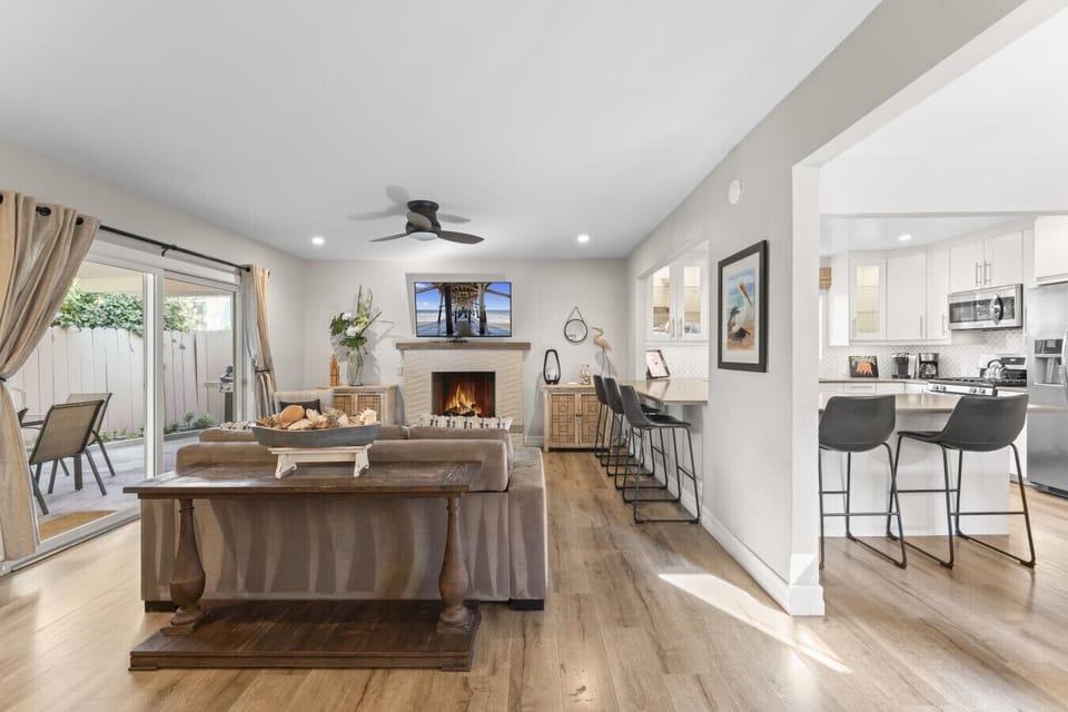 Open living & dining area w/ patio access, perfect for seamless indoor-outdoor living