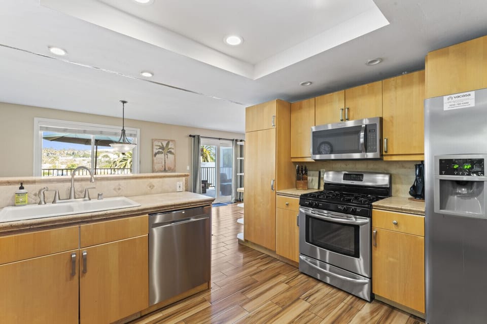 Spacious kitchen with island and patio access