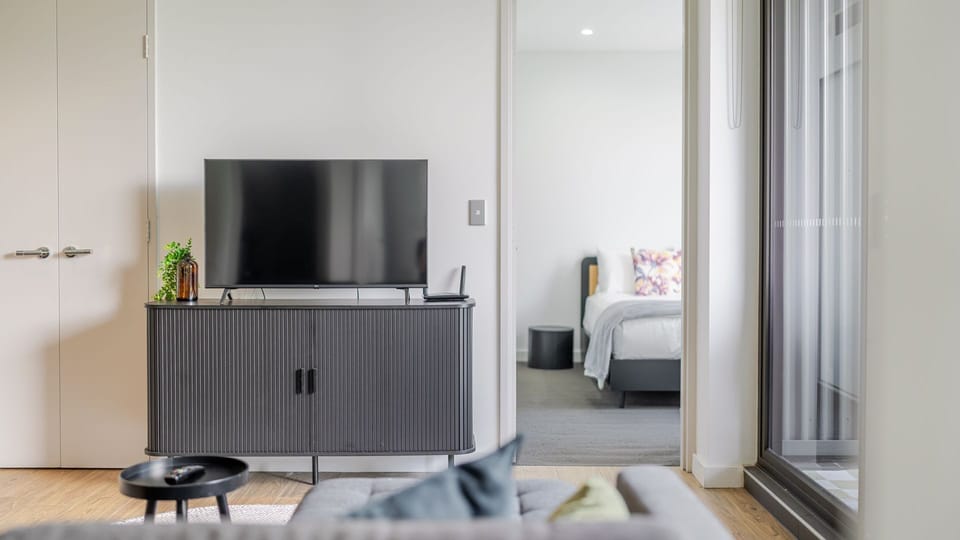 Living area with smart TV and seamless bedroom access