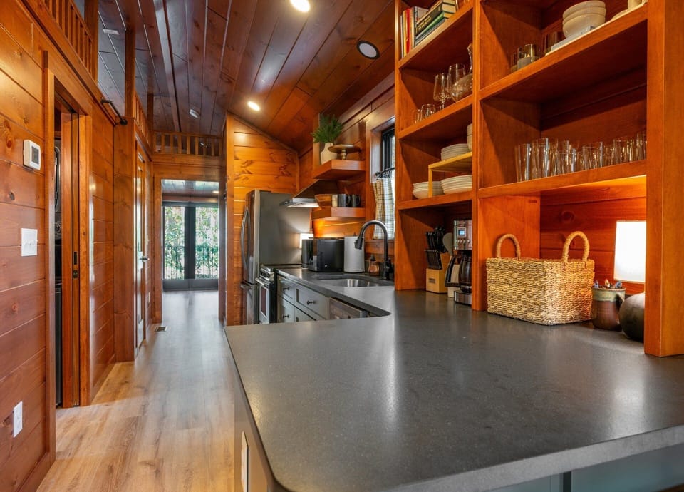 Well-equipped kitchen with dishwasher, drip-style coffee maker, and island seating for 2