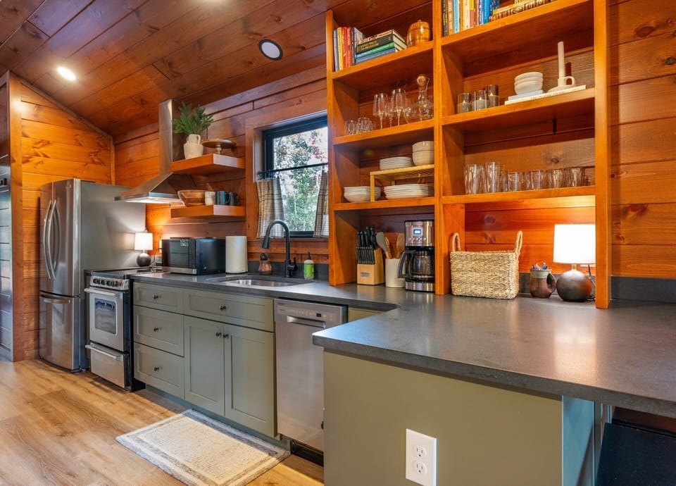 Well-equipped kitchen with dishwasher, drip-style coffee maker, and island seating for 2