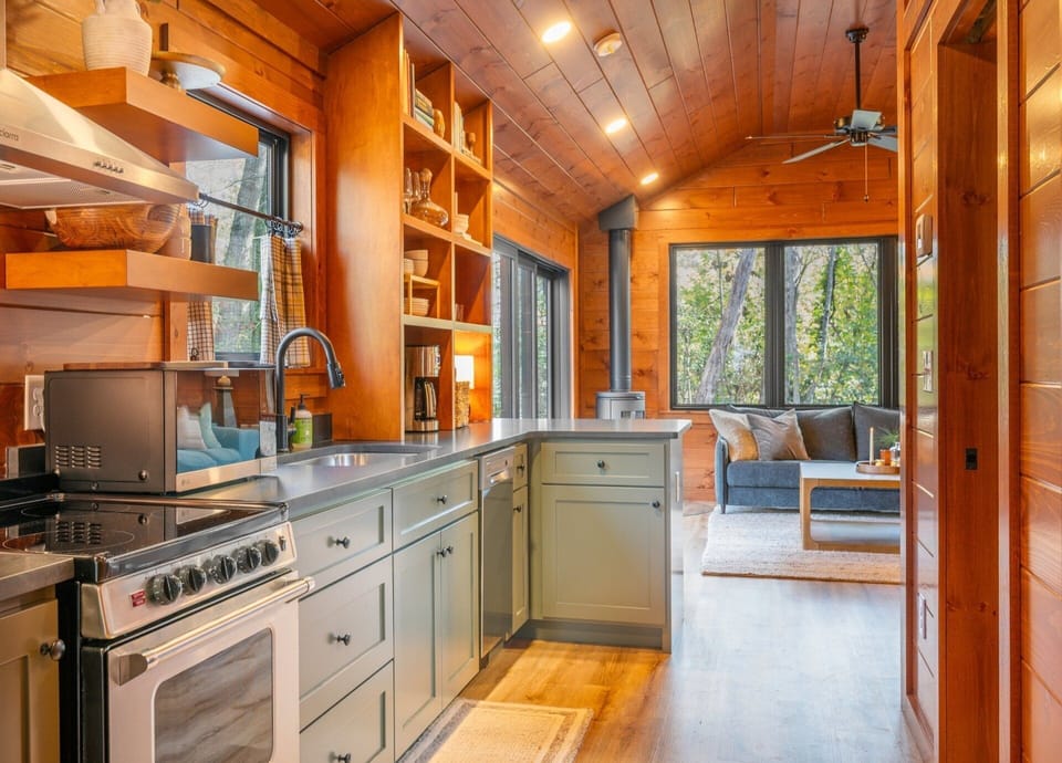 Well-equipped kitchen with dishwasher, drip-style coffee maker, and island seating for 2