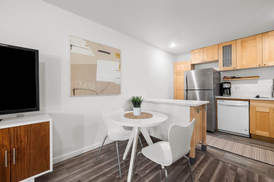 Fully equipped kitchen with appliances and a dining nook perfect for meals at home.
