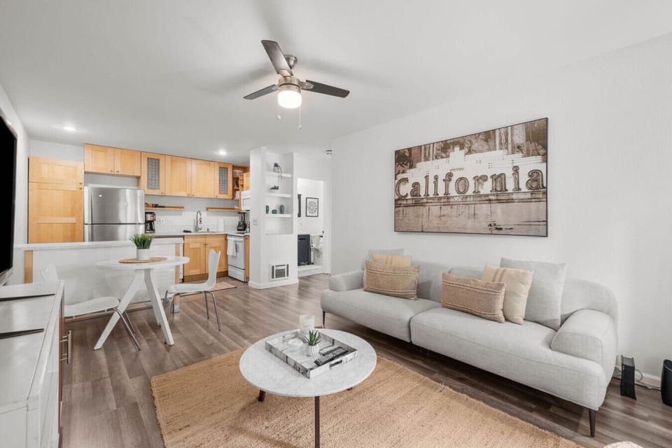 Relax in the stylish living room featuring a comfy sofa, flat-screen TV, and warm California charm.