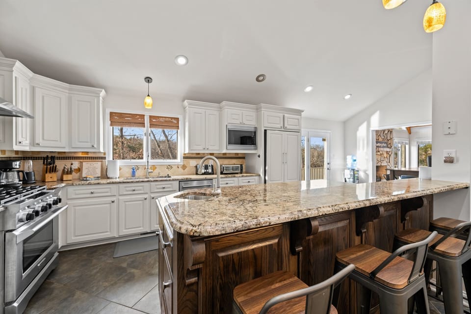 Open fully stocked kitchen off living space.