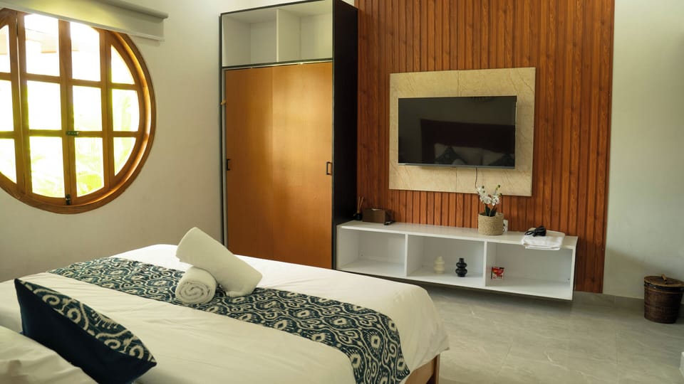 Deluxe Room, Pool View | In-room safe, desk, iron/ironing board, free WiFi