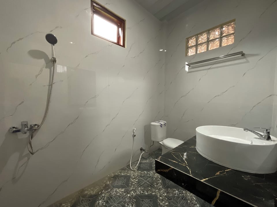 Luxury Quadruple Room, Balcony | Bathroom | Shower, towels, soap, shampoo