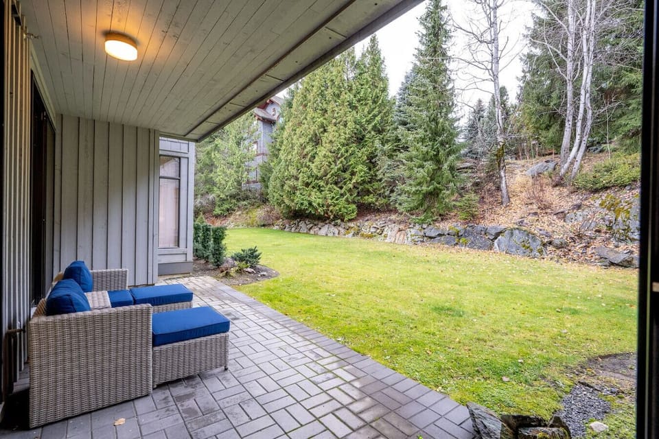 Step outside to a spacious ground-level patio with cozy seating and direct access to the open green space. Let the kids kick a ball and relax with your cup of coffee or glass of wine