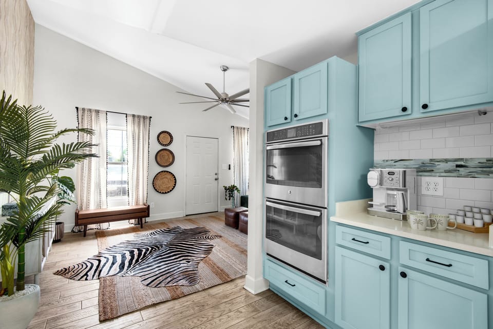 Kitchen features high-end modern appliances.